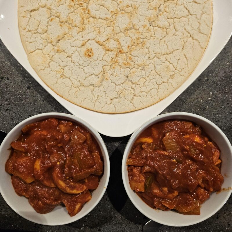 bowls of food with bread