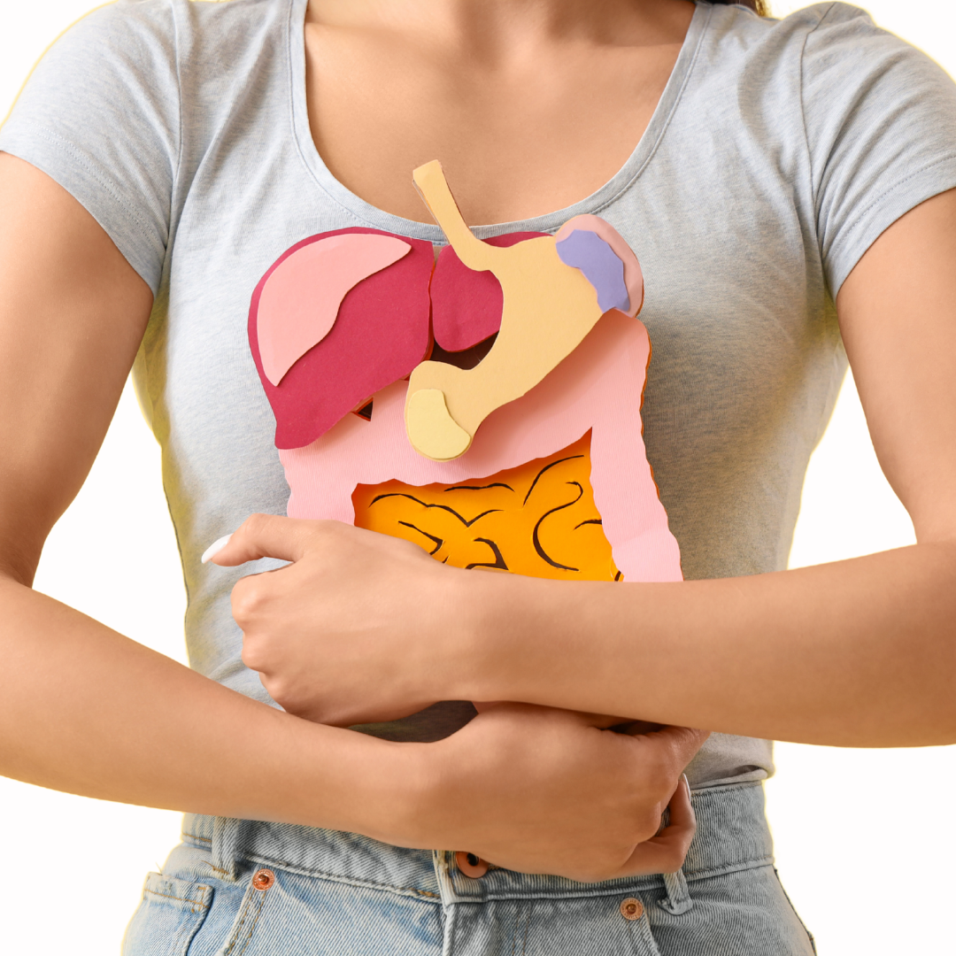 woman hugging digestive organs